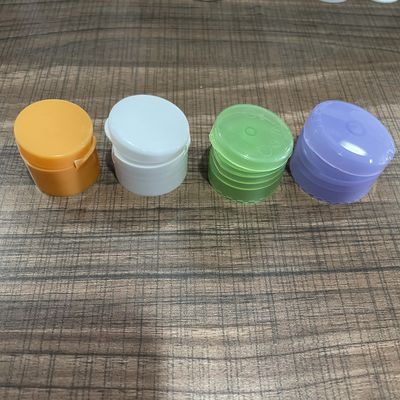 24mm 28mm 32mm カスタマイズされたカラープラスチックローションボトルのためのプラスチックフリップトップキャップ閉塞
